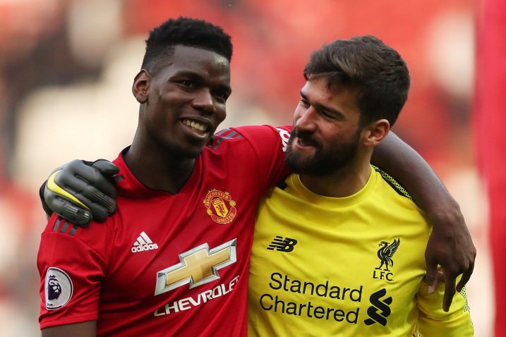 Paul Pogba (Man. United) i Alisson Becker (Liverpool)/Foto REUTERS