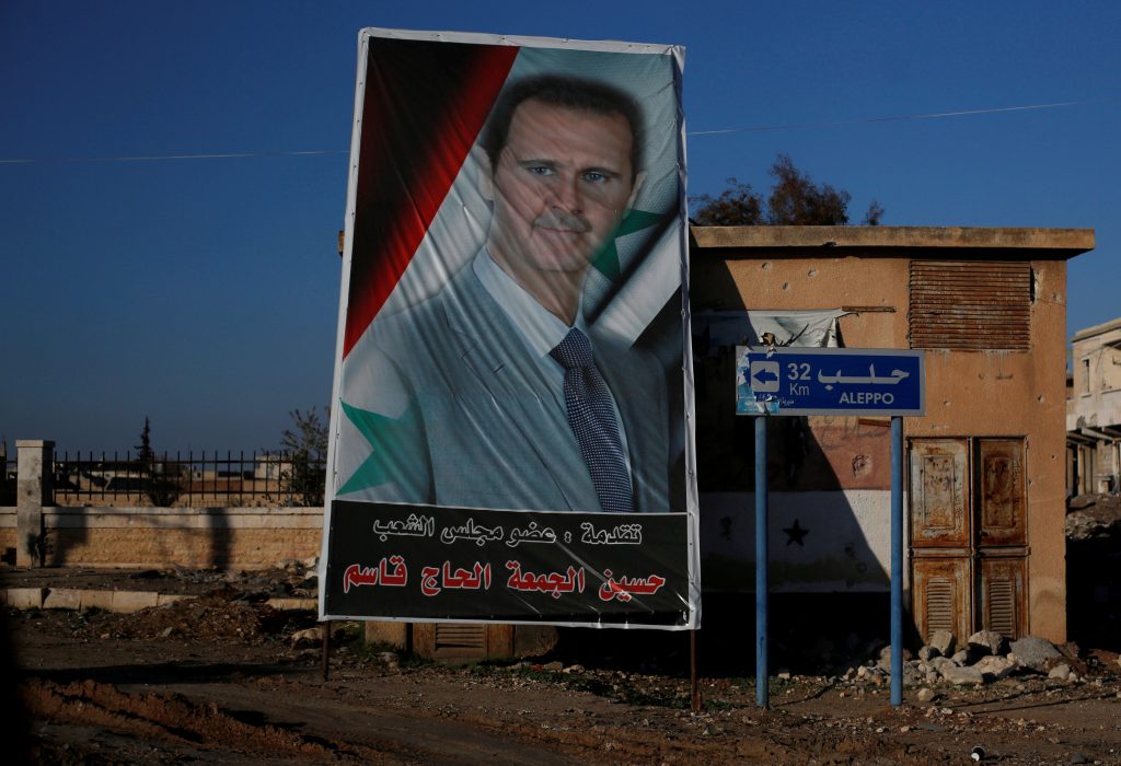 Sirijski predsjednik Bašar Al-Assad na plakatu / Reuters