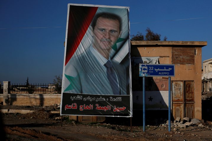 Sirijski predsjednik Bašar Al-Assad na plakatu / Reuters