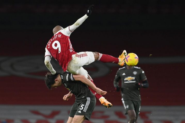 Harry Maguire (Man United) i Alexandre Lacazette (Arsenal)/Foto REUTERS