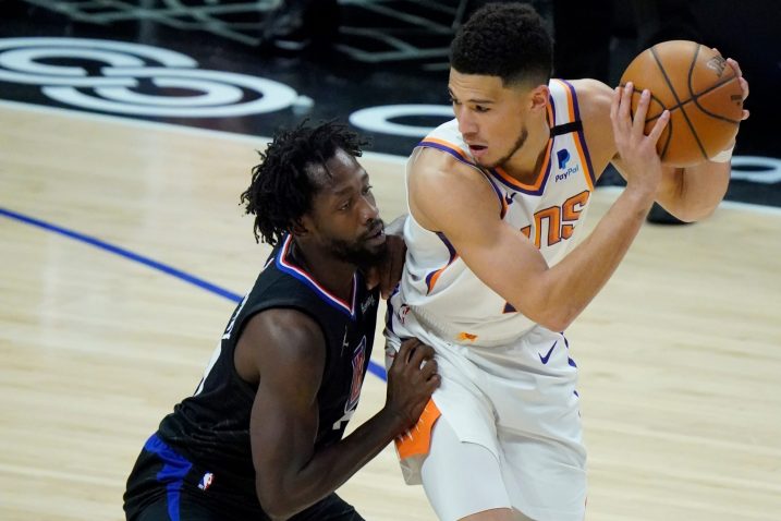 Patrick Beverly i Devin Booker/Foto REUTERS