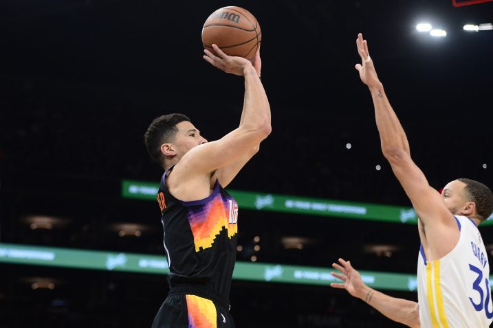 Devin Booker i Stephen Curry/Foto REUTERS