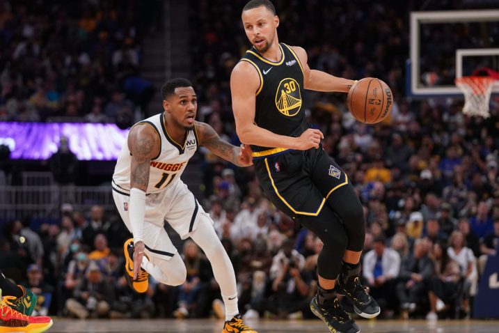 Stephen Curry i Monte Morris/Foto REUTERS