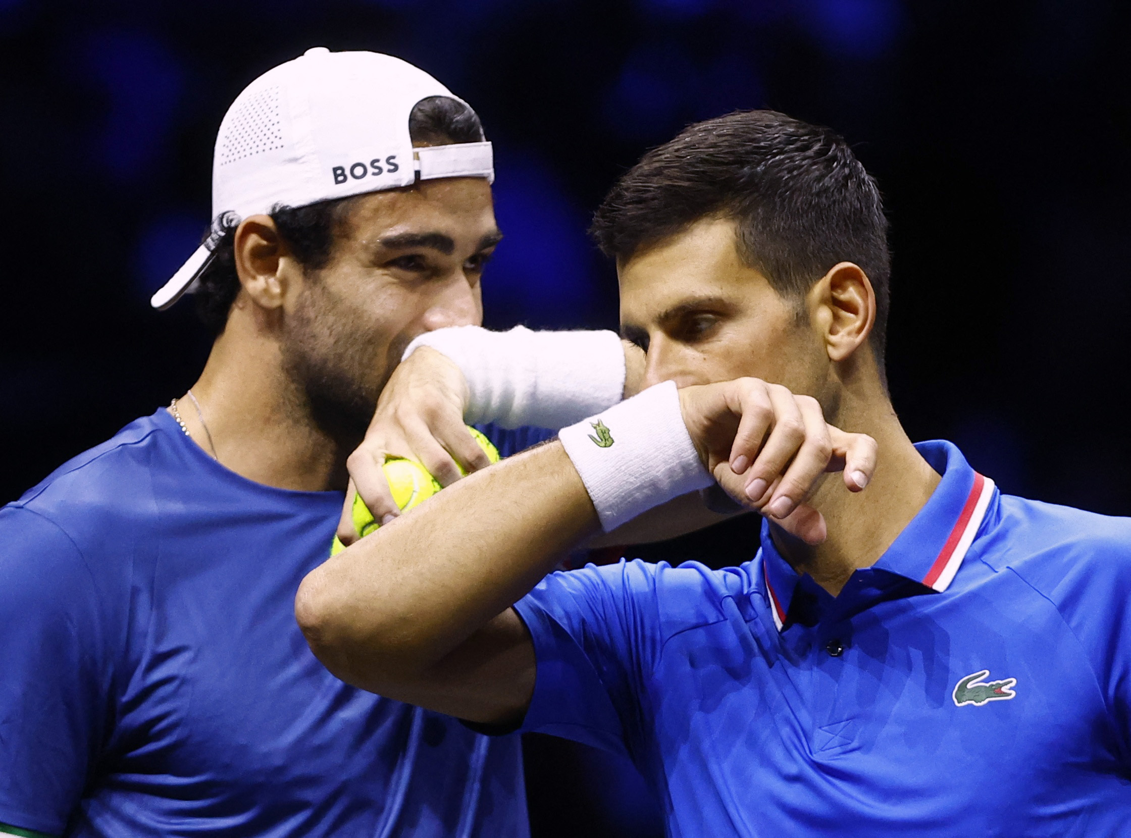 Matteo Berrettini i Novak Đoković/Foto REUTERS