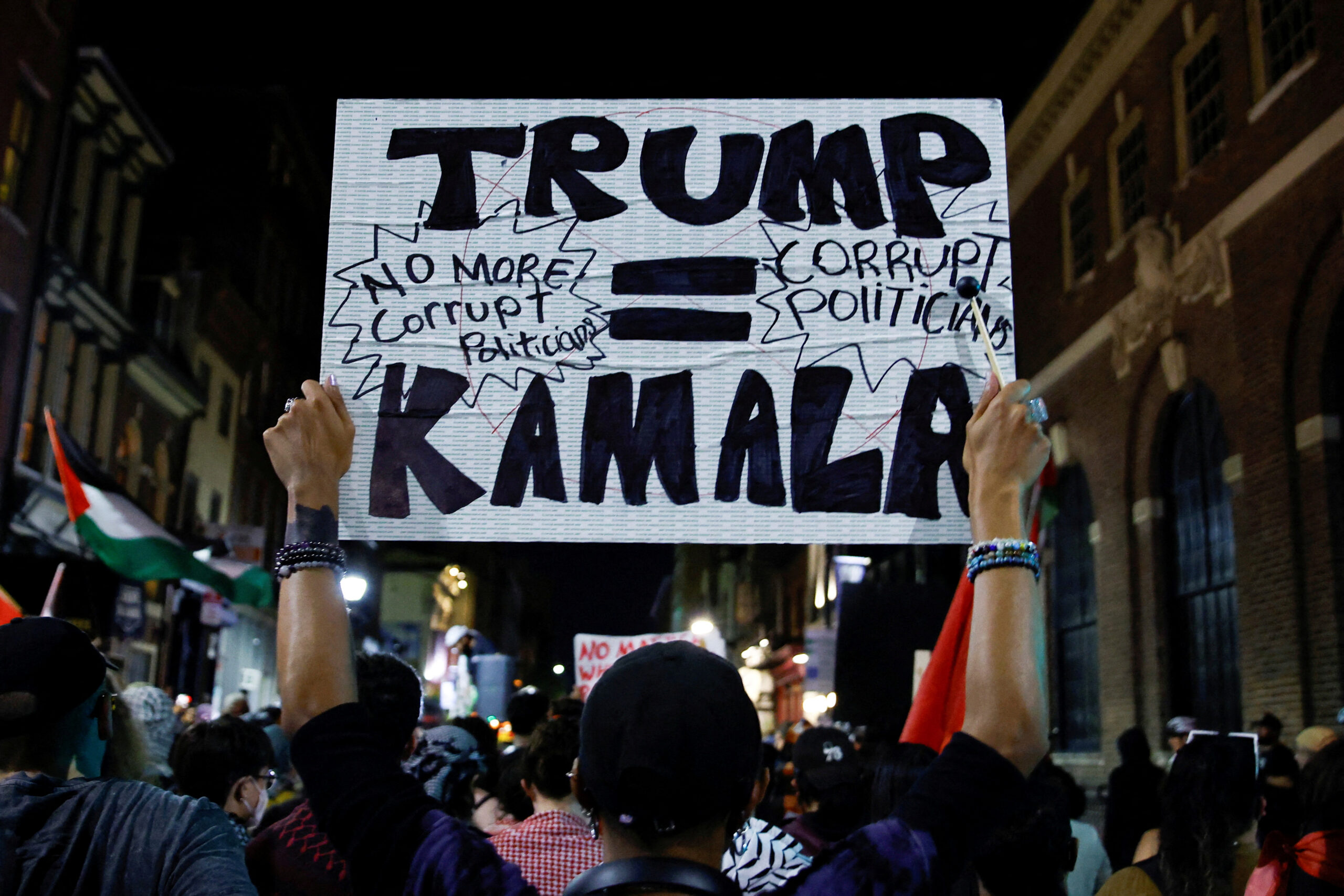 A Pro-Palestinian protester holds up a sign outside the venue of the debate between Republican presidential nominee and former U.S. President Donald Trump and Democratic presidential nominee and U.S. Vice President Kamala Harris in Philadelphia, Pennsylvania, U.S. September 10, 2024REUTERS/Eduardo Munoz