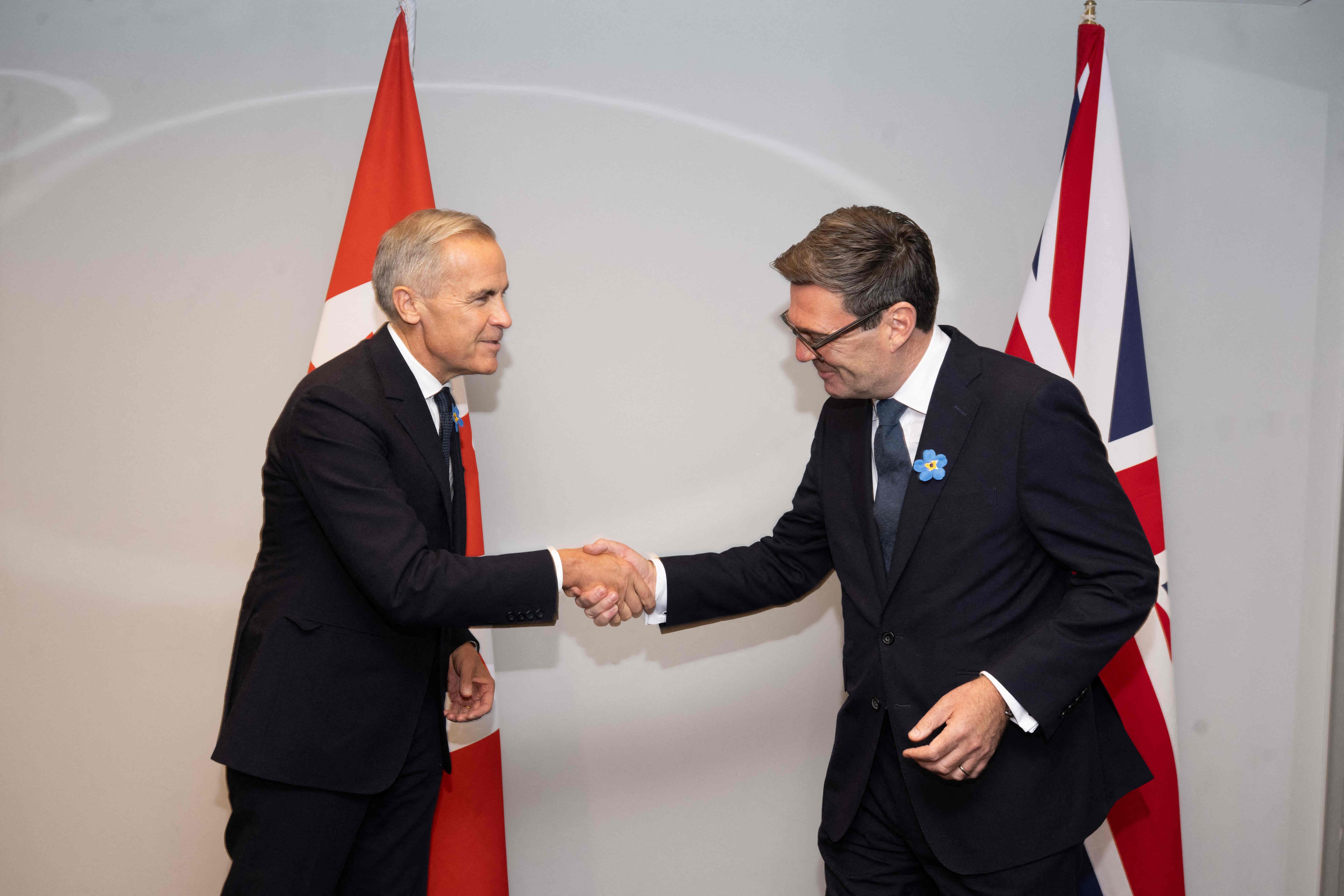 Mark Carney i Andy Burnham / REUTERS